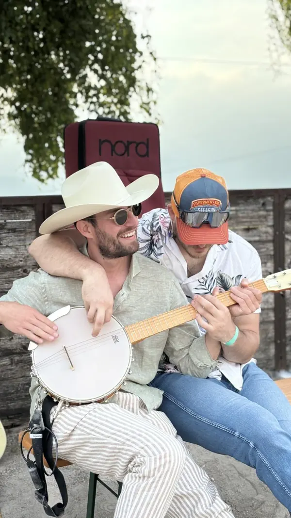Mike and Miglio outdoors with the banjo