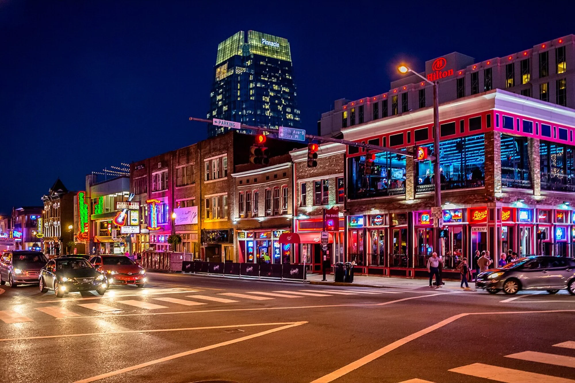Lower Broadway in Nashville at night, the neon signs of the country music bars
